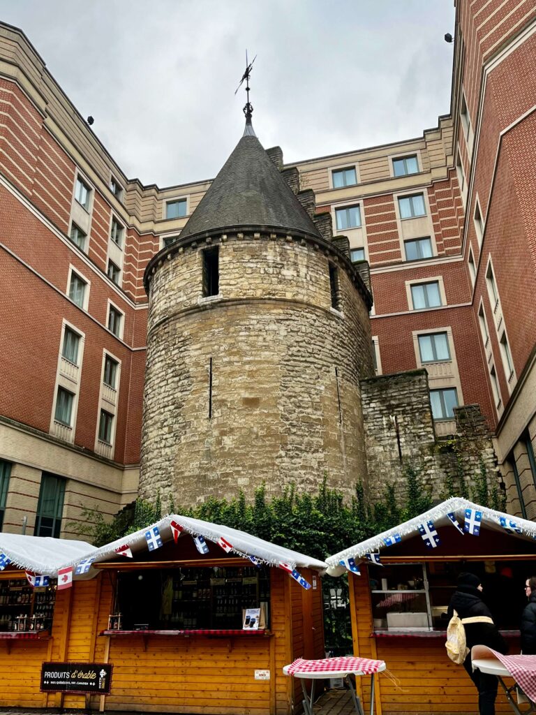 Black Tower located in Brussels with chalets for the Brussels Christmas Market